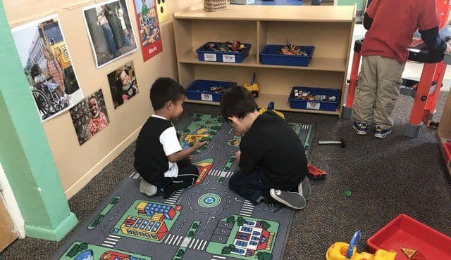Teacher working with children at ABQ Childcare